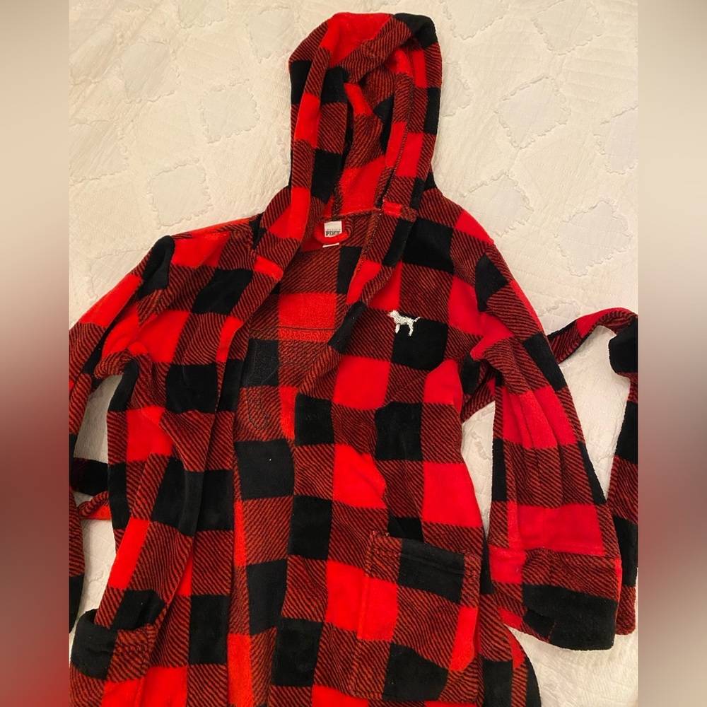 pink black and red checkered fuzzy robe with sequined sparkly logo on the back